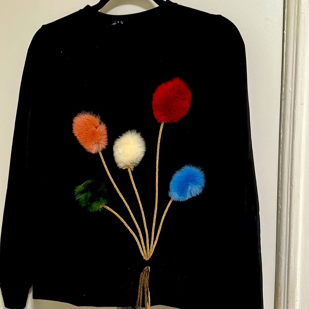 black shirt with fluffy bouquets of colorful cotton flowers